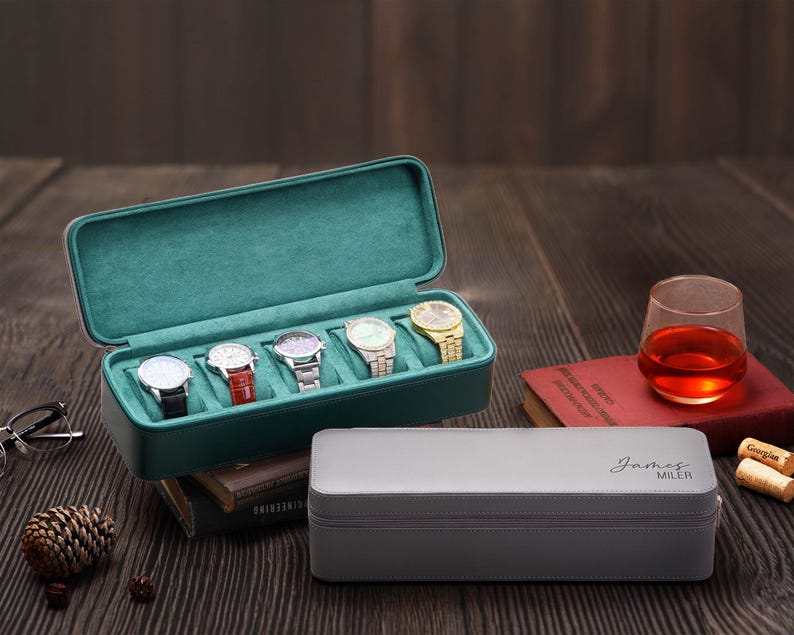 Coffret montre homme design en cuir noir avec espace pour bijoux et montres, parfait pour un cadeau d'anniversaire ou de Saint-Valentin.
