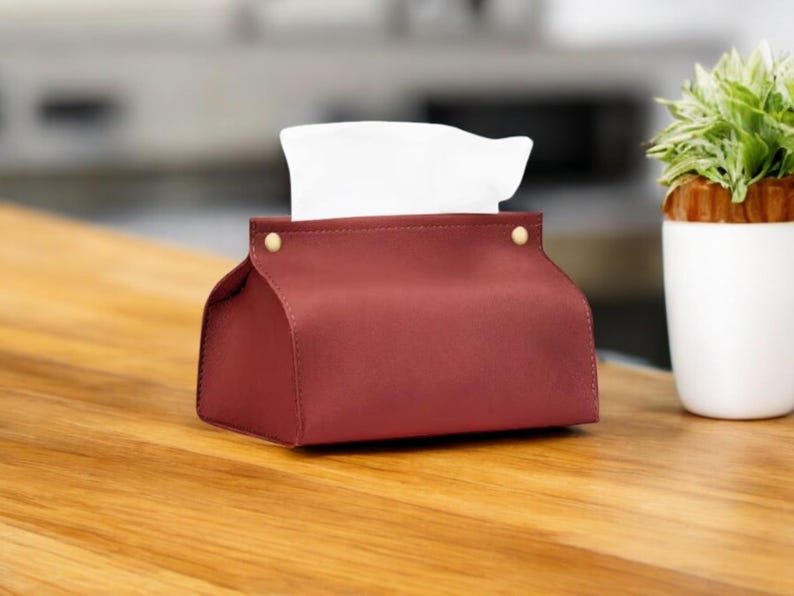 Boîte à mouchoirs luxe avec design élégant en cuir pour maison ou bureau Une boîte à mouchoirs chic et moderne, parfaite pour le salon, le bureau ou comme cadeau raffiné.