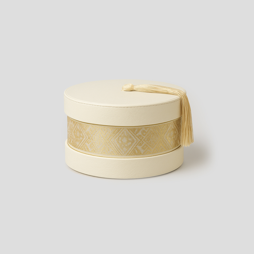 Boîte ronde décorative blanc et or avec gland