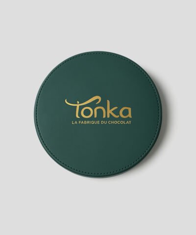 Emballage de luxe sur mesure: coffret de forme ronde et de couleur verte.