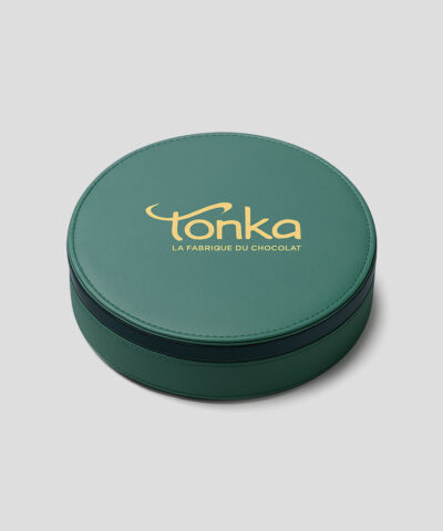 Emballage de luxe : coffret de forme ronde et de couleur verte.